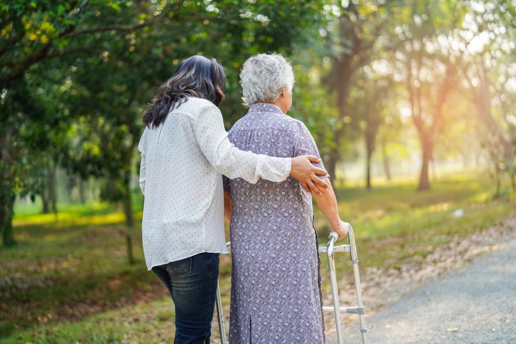 caregiver-help-and-care-asian-senior-woman-use-wal-2022-12-10-01-12-01-utc-1